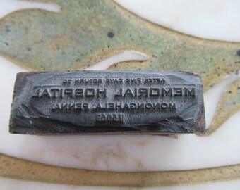 May include: A black rubber stamp with the text "MEMORIAL HOSPITAL" and "AFTER FIVE YEARS RETURN EMA" in white lettering.