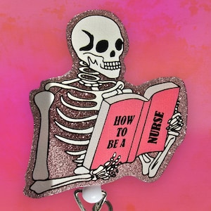 May include: A pink glitter skeleton holding a pink book that says "How to be a Nurse".