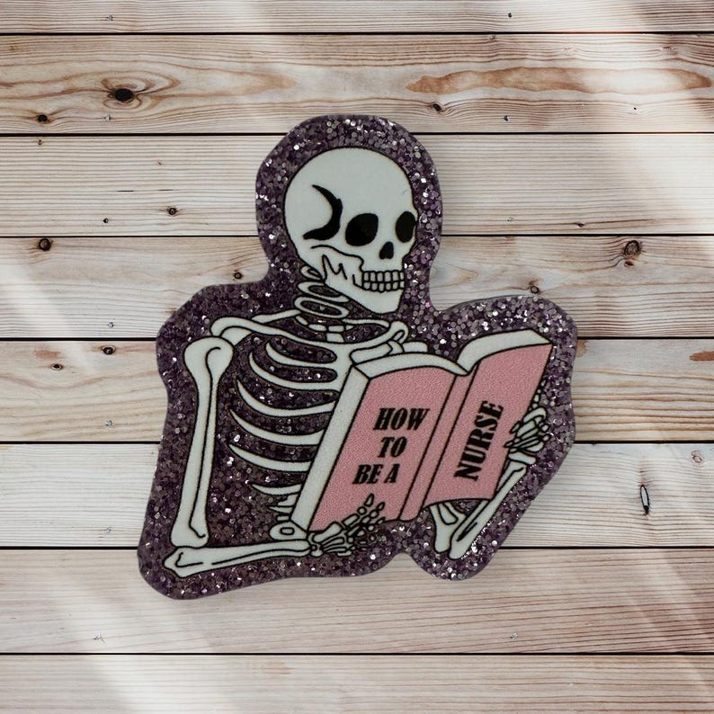 May include: A glittery purple and pink skeleton reading a book titled "How to be a Nurse".