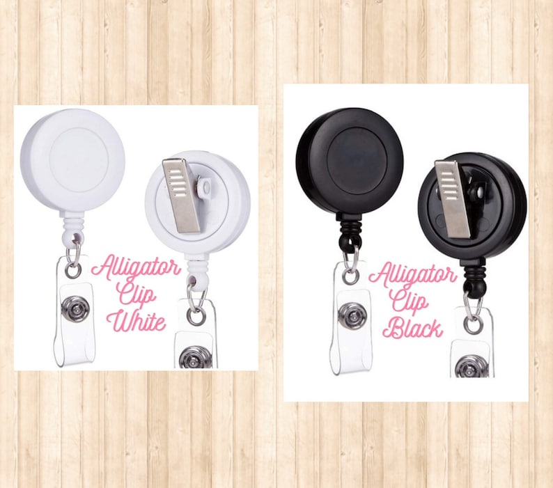 May include: Two retractable badge holders, one white and one black, with alligator clips and the text "Alligator Clip White" and "Alligator Clip Black".