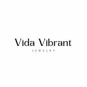 May include: Vida Vibrant Jewelry logo with the text "Vida Vibrant" in a serif font and the word "JEWELRY" in a smaller font below.