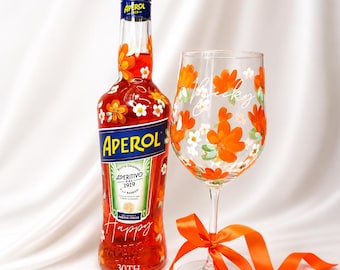Hand painted floral Aperol Spritz glass with personalised name and orange ribbon