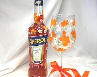 Hand painted floral Aperol Spritz glass with personalised name and orange ribbon