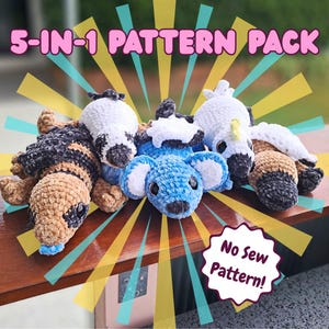 May include: A collection of five crocheted animal plushies, including a koala, a snake, and a bird, are displayed on a wooden surface. The image features text that reads "5-IN-1 PATTERN PACK" and "No Sew Pattern!"
