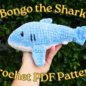 May include: Crochet pattern for a blue and white shark plush toy named "Bongo the Shark".
