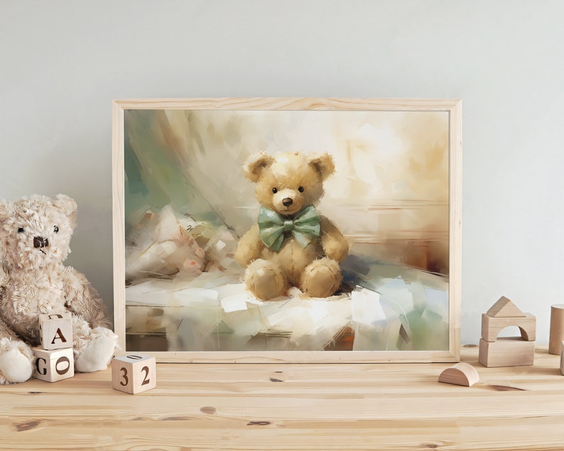 May include: A framed print of a teddy bear with a green bow tie. The bear is light brown and sits on a bed. The artwork has a soft, painterly style with a light color palette. Wooden blocks and a teddy bear are on the table.