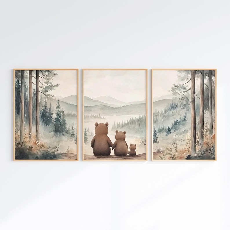 May include: A triptych of framed watercolour prints. The central print shows a bear family, two larger bears and a smaller one, looking at a misty mountain landscape. The side prints depict forest scenes with tall trees.