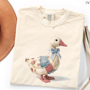 May include: A set of three ceramic mugs with a speckled, matte finish. The mugs are in shades of cream, light gray, and dark gray. Each mug has a simple, minimalist design, perfect for coffee or tea.