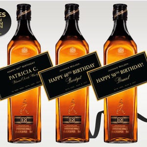 Customizable Johnnie Walker Black Label bottle labels for special occasions. Designs include wedding, groomsmen or best man proposal, milestone birthday, and corporate gifting. Labels feature sleek black and gold color schemes with bold, elegant typography. All text areas are customizable during the order process. Free shipping and fully personalized options available. Labels are displayed on a Johnnie Walker Black Label whiskey bottle.