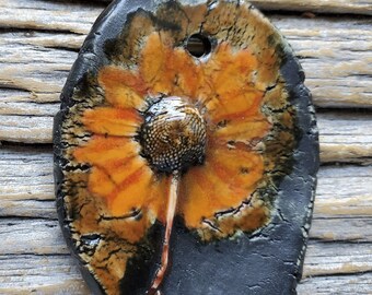 SALE rustic daisy pendant, wildflower, orange on black underglaze, ceramic