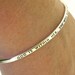 God Is Within Her, She Will Not Fail, scripture jewelry, Bible verse hand stamped on a sterling silver cuff by Kathryn Riechert