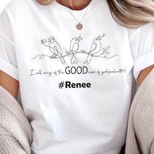 May include: White t-shirt featuring a black line drawing of three birds perched on a branch. The text "I will sing of the GOODness of god psalm 89:1" and the hashtag "#Renee" are printed below the birds.