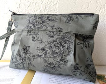Handgelenktasche mit botanischem Motiv: Die perfekte Handtasche für jeden Tag und auf Reisen
