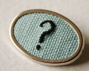 Point d'interrogation broche brodées à la main