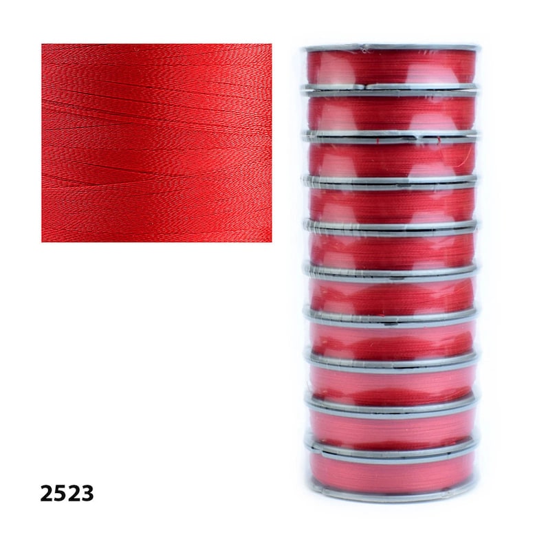A spool of Tytan 100 red thread, strong polyester beading thread for beadwork, embroidery, and jewelry making projects. 100 meters of durable red thread, ideal for crafters looking for reliable and versatile jewelry supplies.