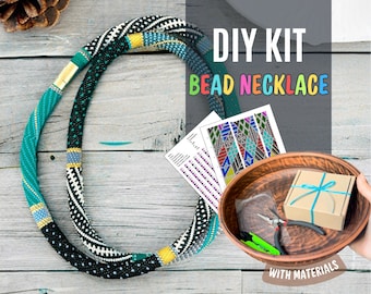 May include: DIY bead necklace kit with materials. The kit includes a pattern, beads, and tools. The necklace is black, white, and turquoise.