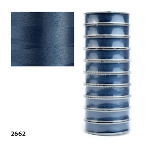 Spools of Tytan 100 thread. Ideal for crafters seeking durable and versatile supplies.