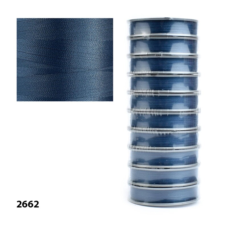 Spools of Tytan 100 thread. Ideal for crafters seeking durable and versatile supplies.