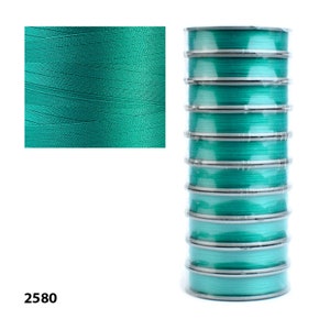 Turquoise Tytan 100 thread, high-quality polyester beading thread designed for beadwork, embroidery, and jewelry making. 100 meters of strong thread, perfect for versatile crafting projects.