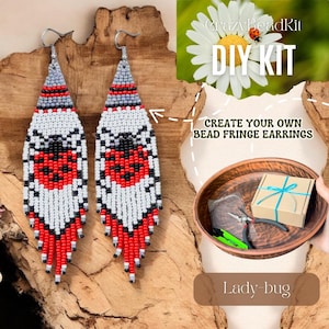 May include: Two beaded fringe earrings with a ladybug design. The earrings feature red, white, black, and gray beads. The image also includes a DIY kit with the text "CrazyBeadKit DIY KIT" and "Create your own bead fringe earrings."