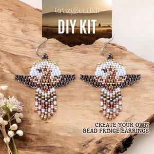 May include: DIY kit to create beaded fringe earrings. The earrings feature a brown, white and gold beaded design with a fringe of beads hanging from the bottom. The kit includes all the beads and supplies needed to make the earrings.