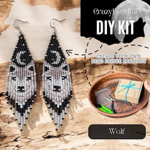 May include: Two beaded fringe earrings with a wolf design. The earrings are black, white, and gray, with a crescent moon at the top. The image also includes a DIY kit with the text "CrazyBeadKit DIY KIT" and "Create your own bead fringe earrings."
