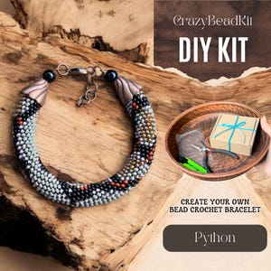 May include: DIY bead crochet bracelet kit, featuring a black, white, and grey beaded bracelet with copper accents. The kit includes all the materials needed to create your own bracelet, including beads, thread, and instructions. The kit is labeled "Python" and "Create your own bead crochet bracelet".
