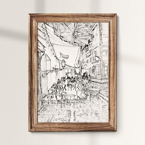 Puede incluir: Dibujo en tinta negra y blanca de una escena callejera parisina con un café y personas sentadas en mesas. El dibujo está enmarcado en un marco de madera.