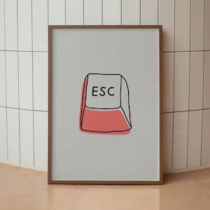 May include: A framed print of a simple line drawing of a computer keyboard key with the word "ESC" on it. The key is red and white.