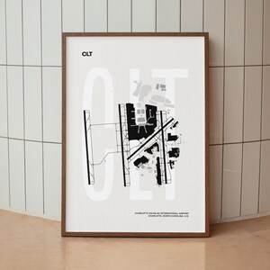 Minimalist black and white map poster of Charlotte Douglas International Airport, showcasing the layout of runways and terminals.