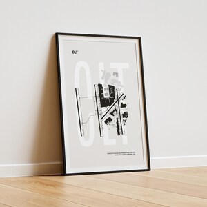Minimalist black and white map poster of Charlotte Douglas International Airport, showcasing the layout of runways and terminals.
