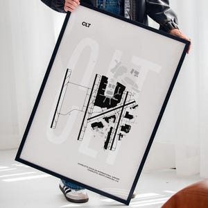 Minimalist black and white map poster of Charlotte Douglas International Airport, showcasing the layout of runways and terminals.