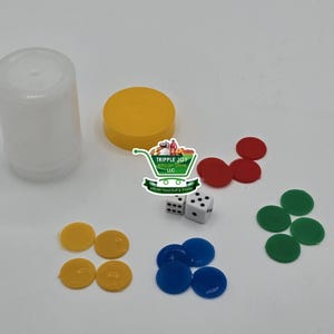 May include: A set of game pieces for a board game. The set includes four yellow, four red, four blue, and four green game pieces. There are also two white dice and a white container.