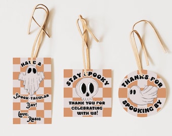 May include: Three Halloween-themed gift tags with orange and white checkered backgrounds. The first tag says "Hale a Spook-tacular Day! Love, Rosie" and features a white ghost. The second tag says "Stay Spooky" and features a black skull. The third tag says "Thanks for Spooking By" and features a white ghost.