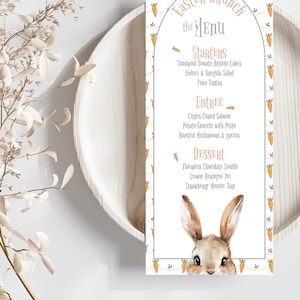 May include: A printable Easter brunch menu featuring a charming bunny rabbit illustration. The menu includes starters, entree, and dessert options. The background features a pattern of carrots and green vines.