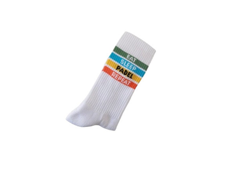 May include: White socks with colorful stripes and the text "Eat Sleep Padel Repeat" printed on them.