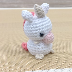 mini crocheted amigurumi unicorn