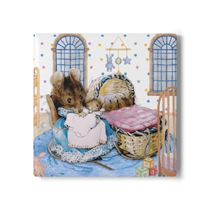 May include: A square print featuring a watercolor illustration of two mice in a nursery setting. The mother mouse holds a baby mouse, both surrounded by a crib, toys, and a mobile. The background has blue and yellow polka dots.