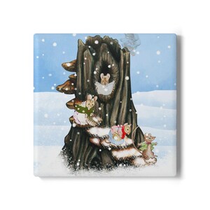 May include: A square canvas print featuring an illustration of mice in a snowy forest scene. A large tree trunk is the focal point, with mice nestled in its hollows and on its branches. The artwork has a whimsical, storybook feel.