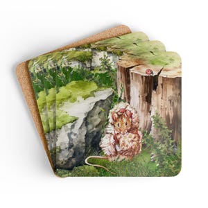 May include: Set of four square coasters with a watercolor illustration of a mouse in a forest setting. The mouse is brown and white, with a red bow. The background features a tree stump, rocks, and greenery.