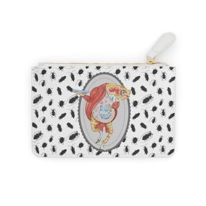 May include: White zippered pouch with a whimsical illustration of a frog in a red coat and apron, holding a teapot. The pouch has a repeating pattern of black insects on a white background. The zipper pull is white.