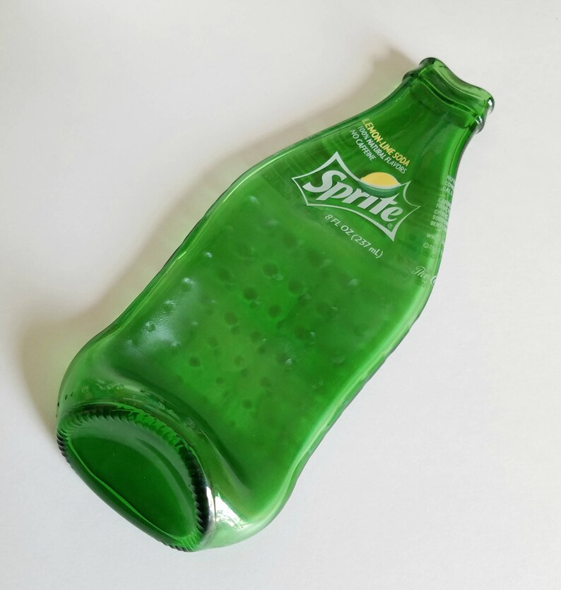 slumped soda bottle  sprite  logo pop bottle  slumped image 0