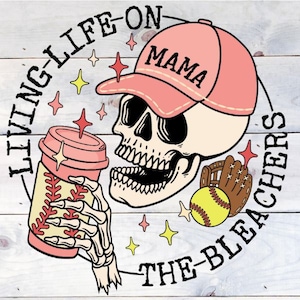 May include: A pink and white skull wearing a pink baseball cap with the word "MAMA" on it. The skull is holding a pink and white coffee cup with a baseball design. The skull is surrounded by a circle with the text "LIVING LIFE ON THE BLEACHERS".