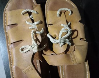 Vintage 1970s Skootskates; soft shell buckskin, tan colored leather, lace up (original laces).  Size 8 women