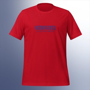 May include: Red t-shirt with the text "Introverts are just more selective" in blue.