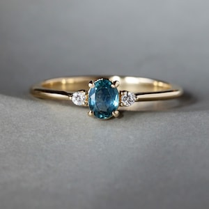 Montana Sapphire Ring with Accent Diamonds, Dainty Three Stone Engagement Ring, Solid 14k Gold with Teal Blue Oval Sapphire