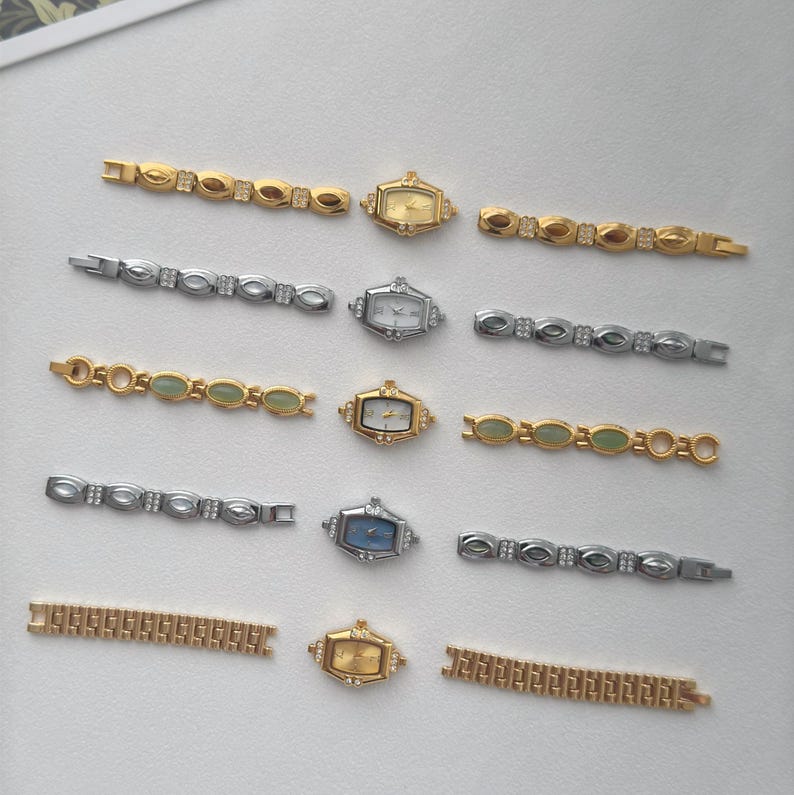 May include: An assortment of vintage women's watches and watch bands in gold and silver tones. The watches have rectangular faces with various dial colors, including gold, white, and blue. The bands feature decorative links with gemstones.