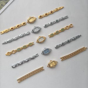 May include: An assortment of vintage-style women's watches and watch bands. The watches have gold and silver-toned cases with various colored faces. The watch bands are gold and silver-toned, some with decorative stones.