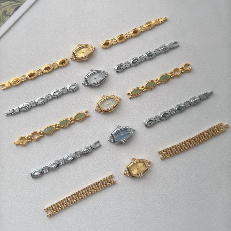 May include: An assortment of vintage-style women's watches and watch bands. The watches have gold and silver-toned cases with various colored faces. The watch bands are gold and silver-toned, some with decorative stones.