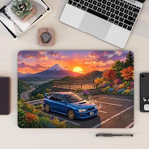May include: Blue sports car parked in a scenic landscape with a mountain and sunset. The car is in a parking lot with colorful flowers and trees. The background features a mountain, a highway, and a vibrant sunset.